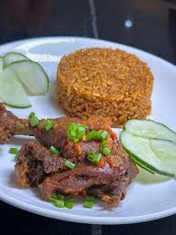 JOLLOF RICE (MINI) + CHICKEN WINGS